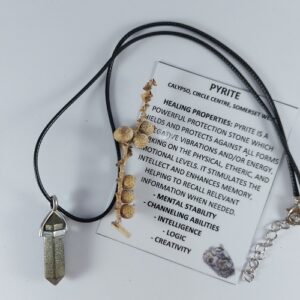 Pyrite point necklace on woven strap