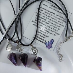 Amethyst point and charm necklace on woven cord