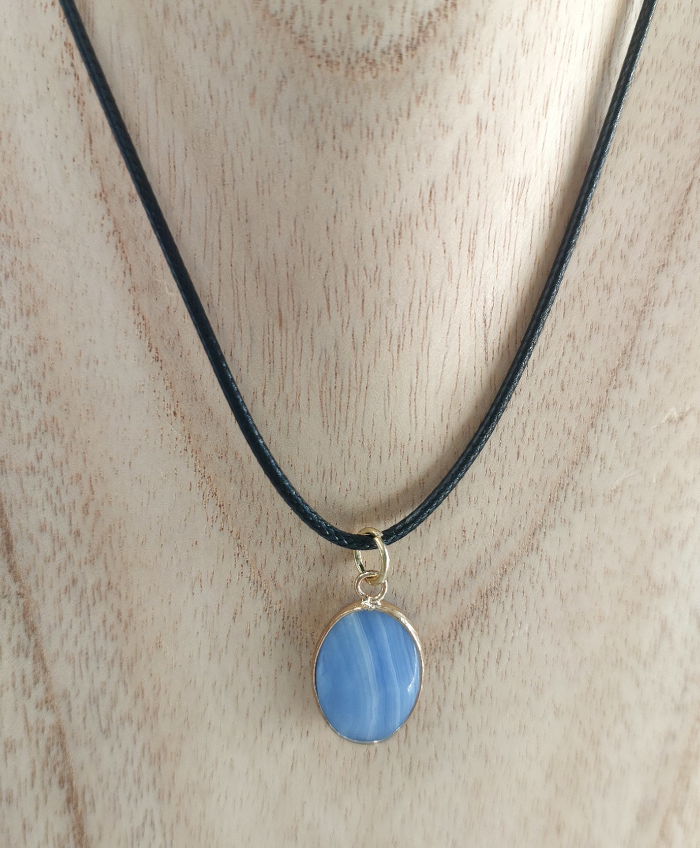 Oval Blue Lace Pendant Necklace in gold colour metal setting